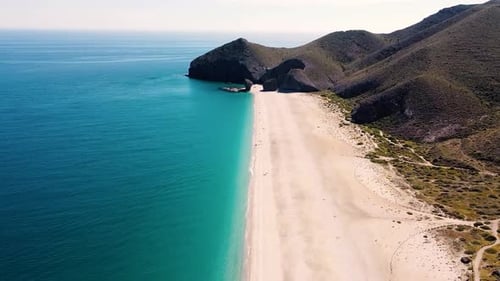 Seashore, coastline, scenic view of people at unspoiled beach in Almeria, called Playa de los Muerto