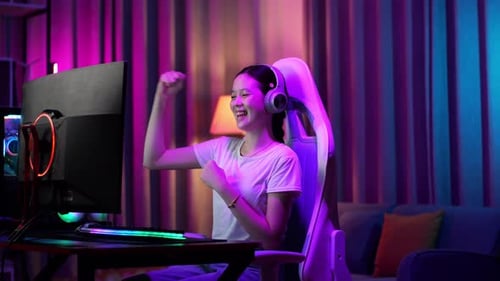 Enthusiastic Woman Winning While Gaming at Home