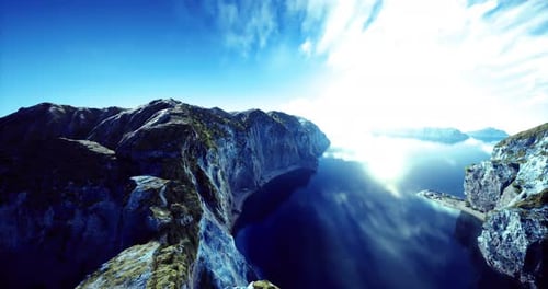 Stunning Coastal View at Sunrise Over Calm Waters and Rocky Cliffs in Nature
