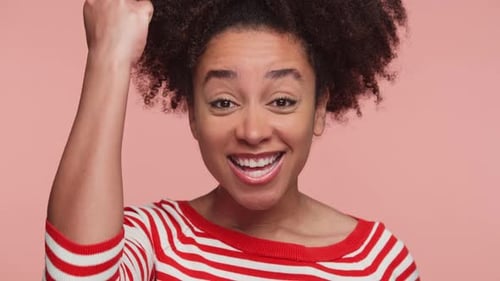 Woman Cheering and Raising Fist in Celebration