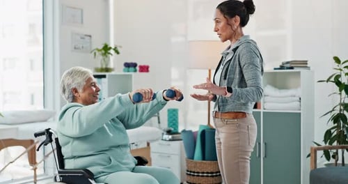 Senior Woman Doing Arm Exercises with Therapist