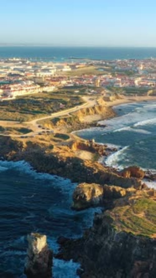 Drone Approach and Fly Over Peniche Town Cliffs and Sunset Portugal