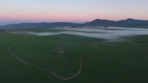 Aerial view of green fields and fog, South Africa.