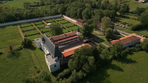 aerial shot around the batie d'urfe castle revealing the landscape of the forez plain in loire depar