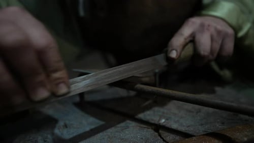 Sharpening Iron Blade Cutting Tool Handmade Artisan Workshop Calloused Hands Craftsmanship Precision
