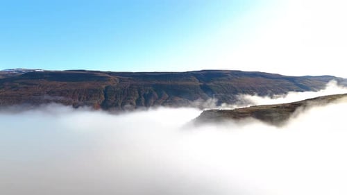 Aerial view of dense fog on mountain landscape of Iceland