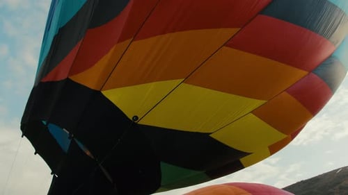 Colourful hot air balloon preparing for flight
