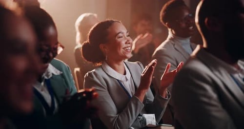 Smiling Audience Clapping at Corporate Presentation