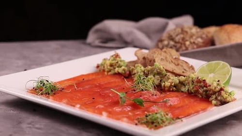 chef prepares a salmon dish in the kitchen. Close-up shots
