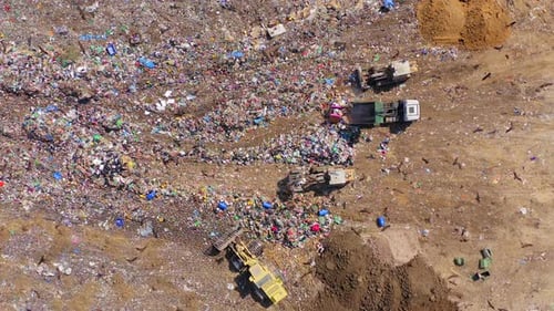 Compacting trash at a local landfill, Aerial view