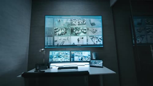 CCTV Footage Displayed on Computer Monitors and Big Digital Screen