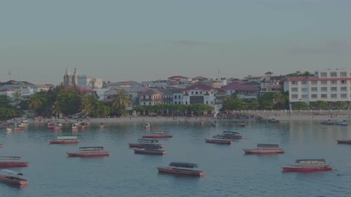 Aerial drone stock footage Zanzibar Island over water boat shoreline