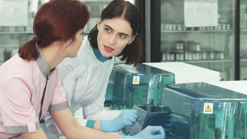 Female Scientists Working With Equipment In a Lab