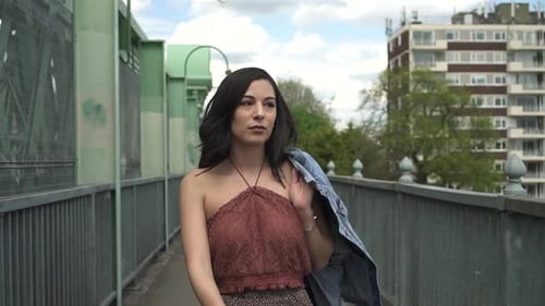 Stylish Woman Walking Confidently in an Urban Setting