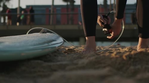 Surfer Man Walking to the Beach at Sunset Preparing for Surfing Training and Search for Waves in