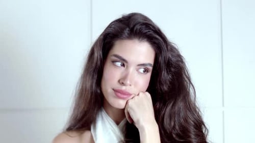 Young Woman Posing with Hand on Face