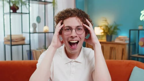 Man Reacting with Surprise and Excitement Indoors