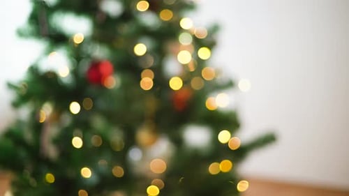 Christmas Gift Exchange with Tree and Lights Blurred