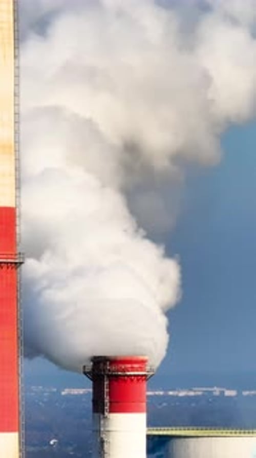 Industrial Smokestacks Emitting Billowing Smoke
