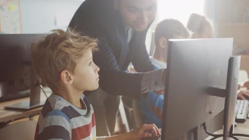 Elementary School Science Classroom: Enthusiastic Teacher Talks with a Smart Schoolboy. Using Perso