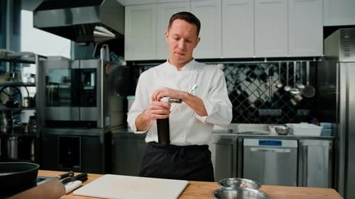 Chef Operating Culinary Torch in Commercial Kitchen