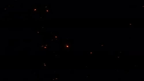 Rising Fire Embers Particle Overlay on Black Background