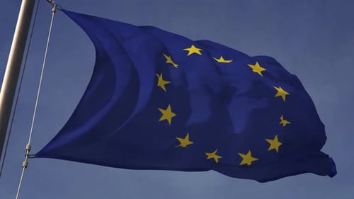 Waving European Union Flag Against a Blue Sky