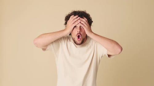 Man Reacts with Shock, Surprise, and Disbelief