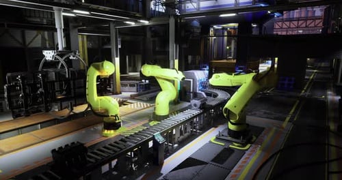 High Tech Robotic Arms Work on an Assembly Line in a Modern Factory Setting