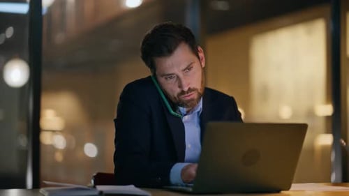 Busy Employee Calling Smartphone Typing Laptop at Night Office Closeup