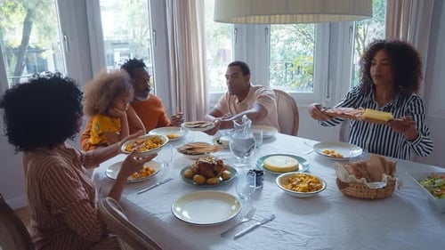 Family Eating Meal Together at Home