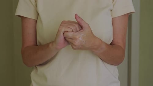 Woman Hands Applying Hand Cream
