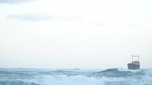 Wide Shot White Overcast Sky with Stormy Ocean and Ship Wrecks on the Right