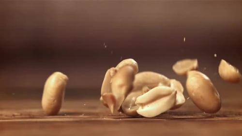 Peanuts Fall on the Table Filmed on a Highspeed Camera at 1000 Fps