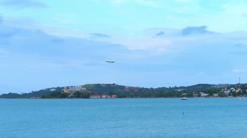 A Passenger Plane Flies Over a Huge Ocean Preparing to Land in a Tourist Paradise Island