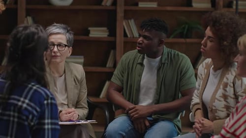 Group Applause During Therapy Session in Supportive Circle