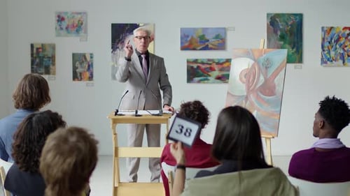 Auctioneer Calling Out Bids on Art Auction