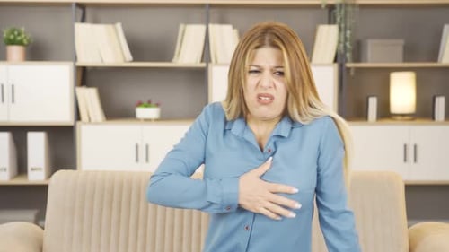 Woman having heart attack.