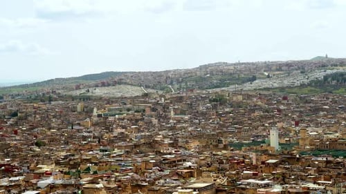 From a high point in Fez, Morocco, the city’s panoramic view is enchanting, with terracotta houses a