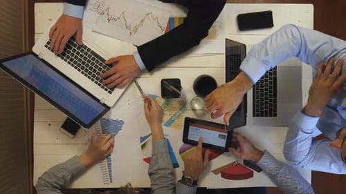 Top View to Male and Female Hands of Colleagues Working As Teamwork on Business Development at