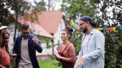 Friends Dancing Together at an Outdoor Party