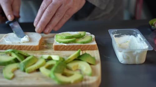 Preparing Healthy Avocado Toast with Cream Cheese