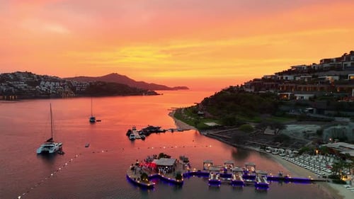 Vibrant Beach Pier Party at Sunset – Drone Footage