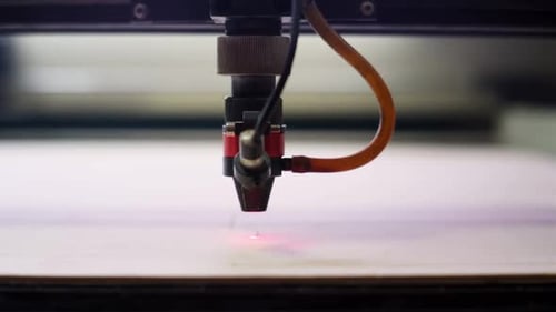 Laser Cutting Machine Operates with Piece of Wood Close View