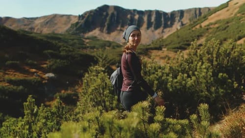 Woman Walking Tourist Trail in Carpathians Shpytsi