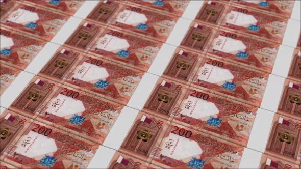 200 QATARI RIYAL banknotes printed by a money press, Infographics ...