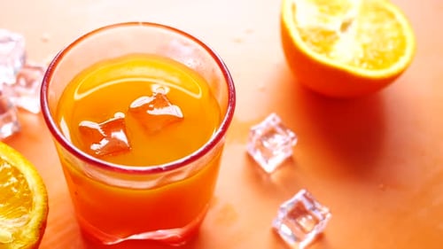 Refreshing Orange Juice With Ice Cubes And Fruit