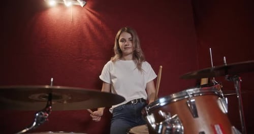 Blonde Woman Drummer Performing in Music Studio