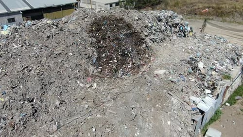 Aerial View of Massive Refuse Pile in Industrial Area