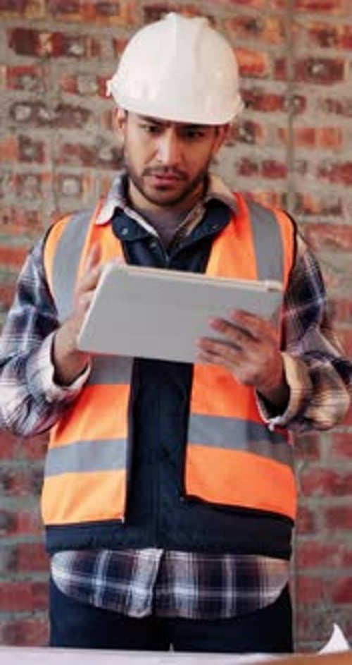 Architect, confused and man with tablet in building, research or plan for architecture design